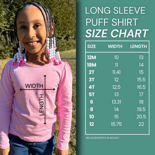 a young girl wearing a pink shirt with a size chart